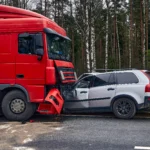 Big red truck crash with grey crossover car